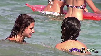 Two Italian girls playing under the water on the topless beach